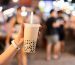 Asian,Woman,Holding,The,Famous,Taiwanese,Bubble,Milk,Tea,At